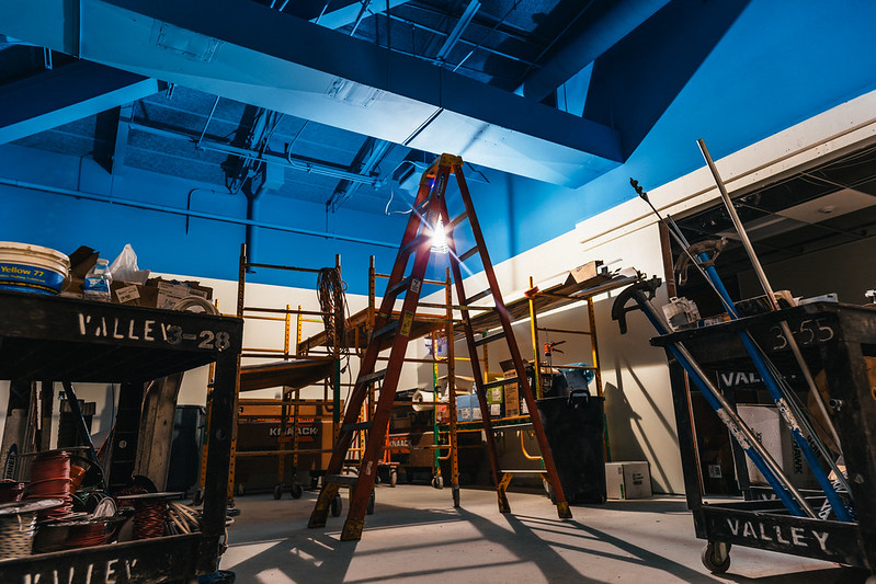 Renovation image showing a ladder and fresh paint work