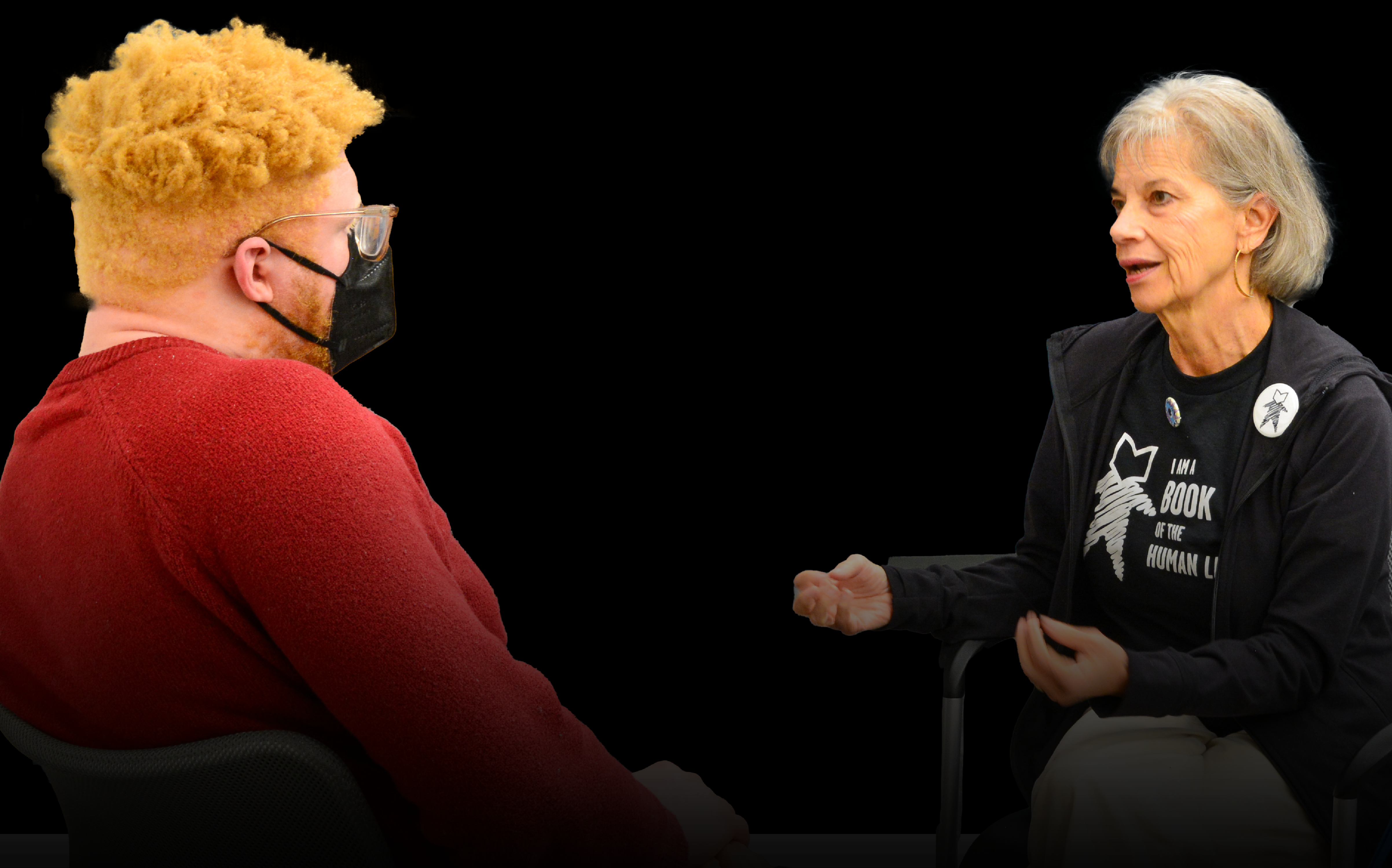 Image of two people in conversation making eye contact and connecting