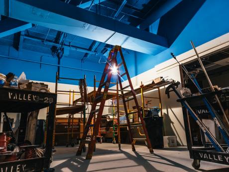 Renovation image showing a ladder and fresh paint work