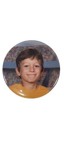 button of a boy in his soccer uniform. 