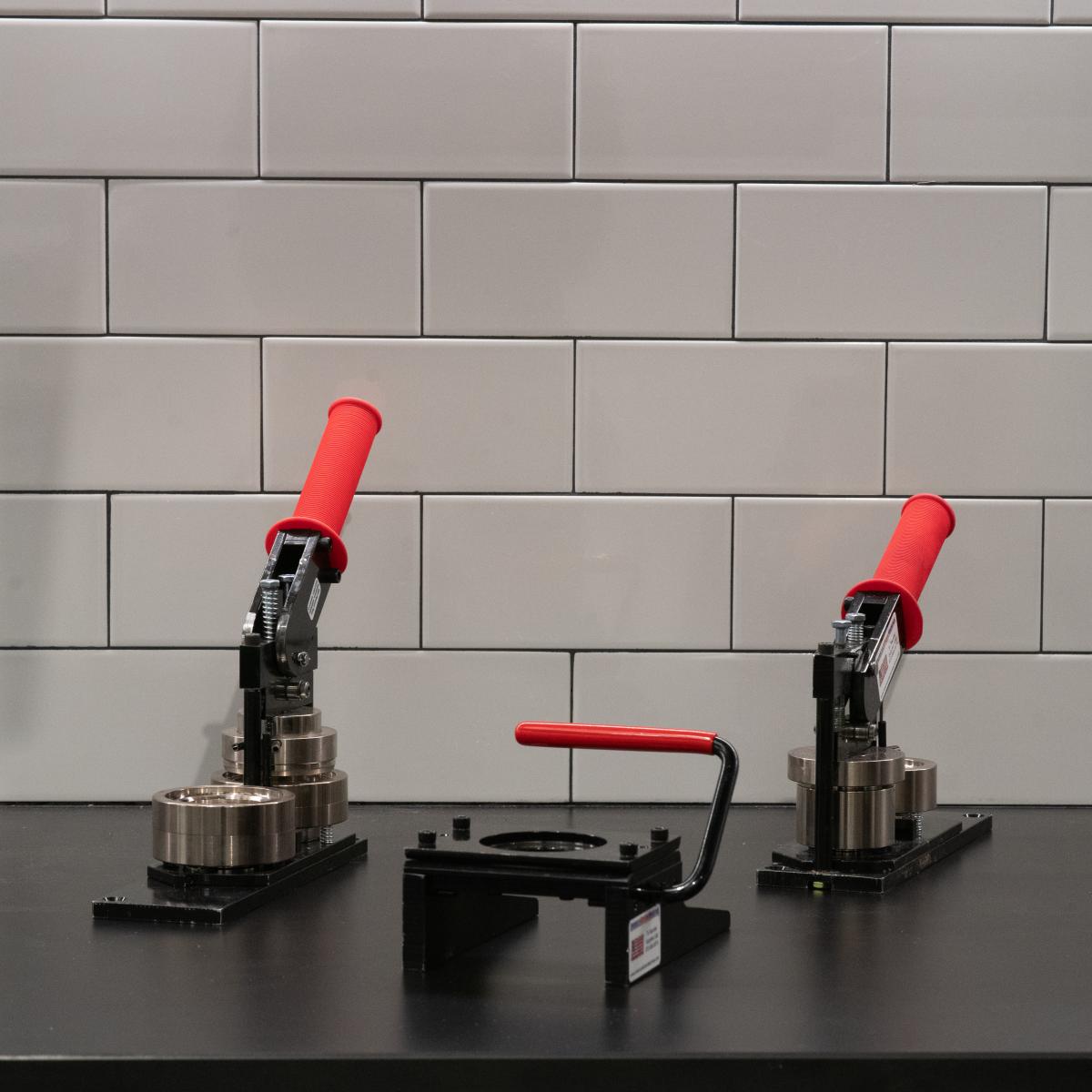 a photo of both of our button makers