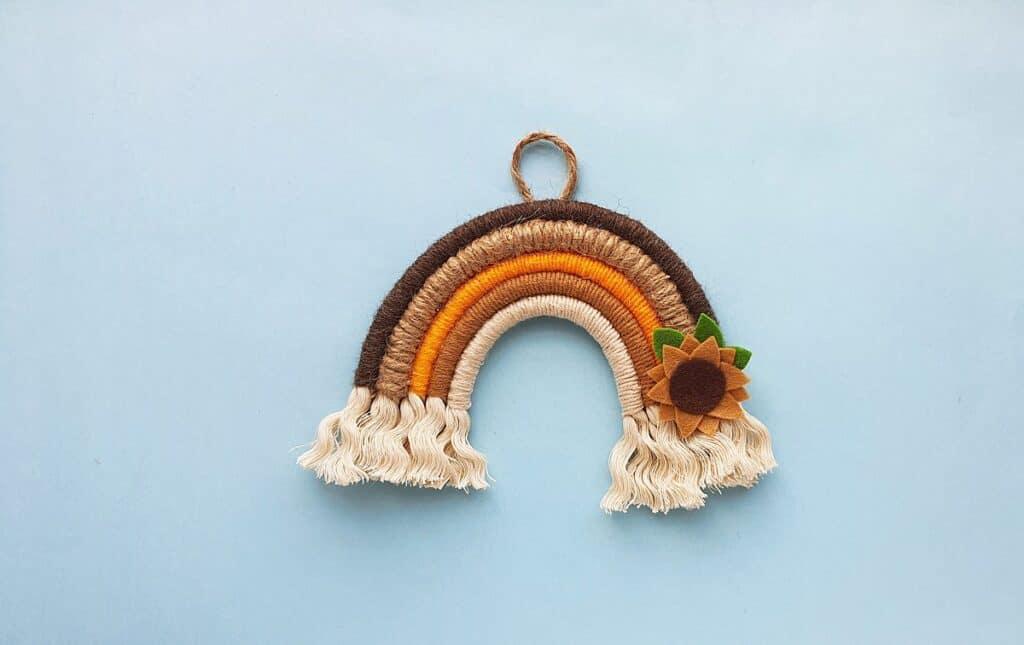 brown and tan rainbow on a light blue background