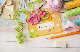 Colorful crafting supplies and a handmade card. 