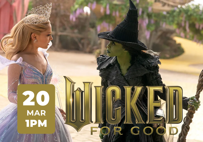 Film still of Cynthia Erivo and Ariana Grande looking at each other.