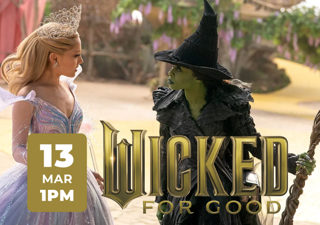 Film still of Cynthia Erivo and Ariana Grande looking at each other.